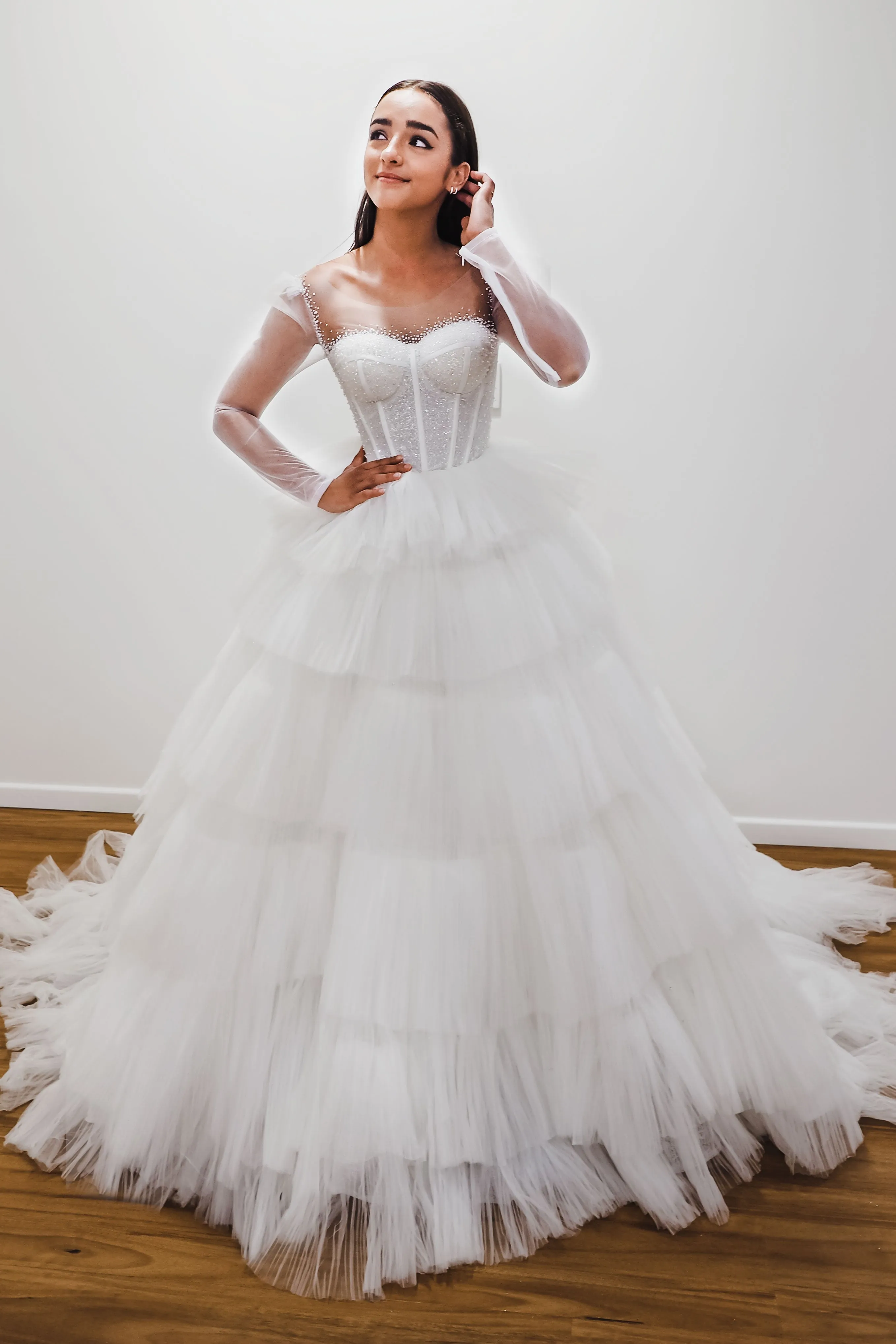 White wedding dress with a bushier top and a bushier puffy layered skirt for hire