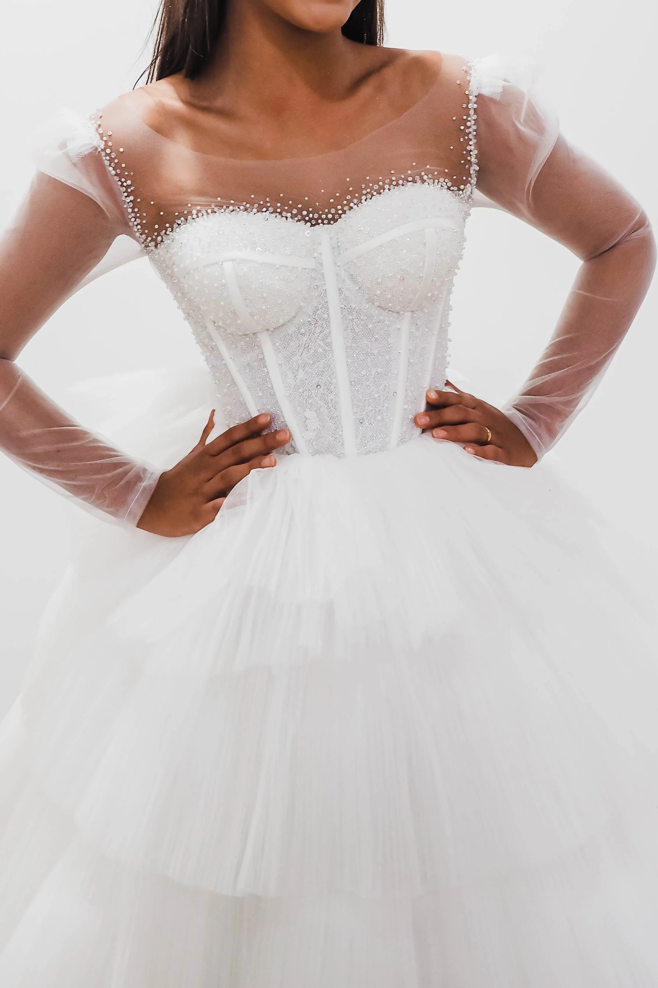 White wedding dress with a bushier top and a bushier puffy layered skirt for hire