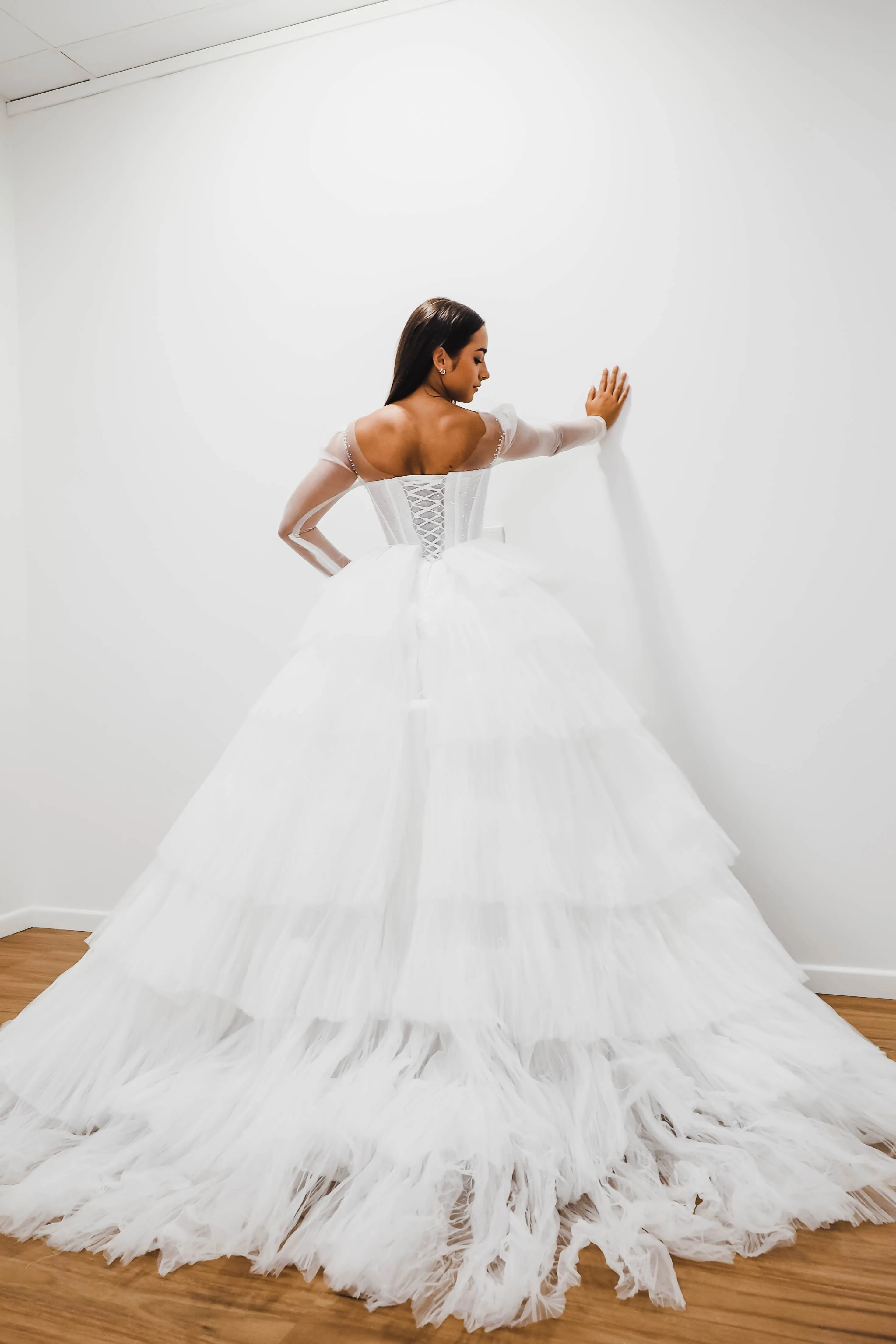 White wedding dress with a bushier top and a bushier puffy layered skirt for hire