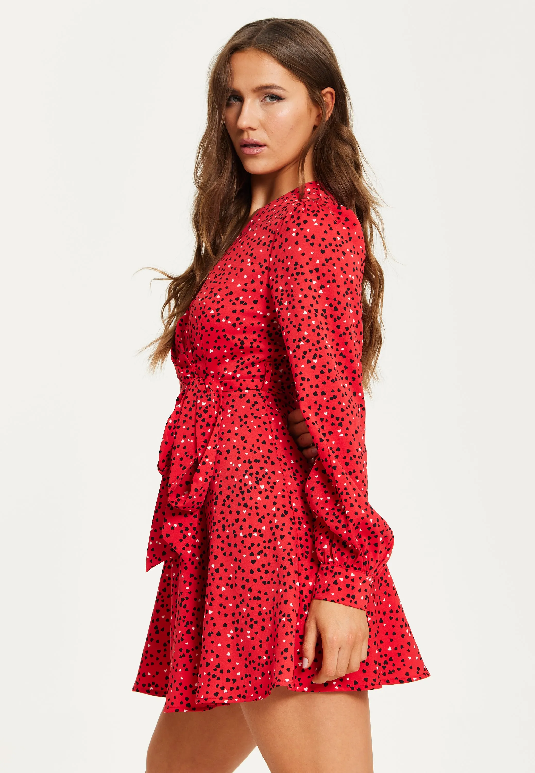 Women's Mini Dress with Long Sleeves in Red - Heart Print Wrap Style, V Neck, Adjustable Tie Waist, by Liquorish