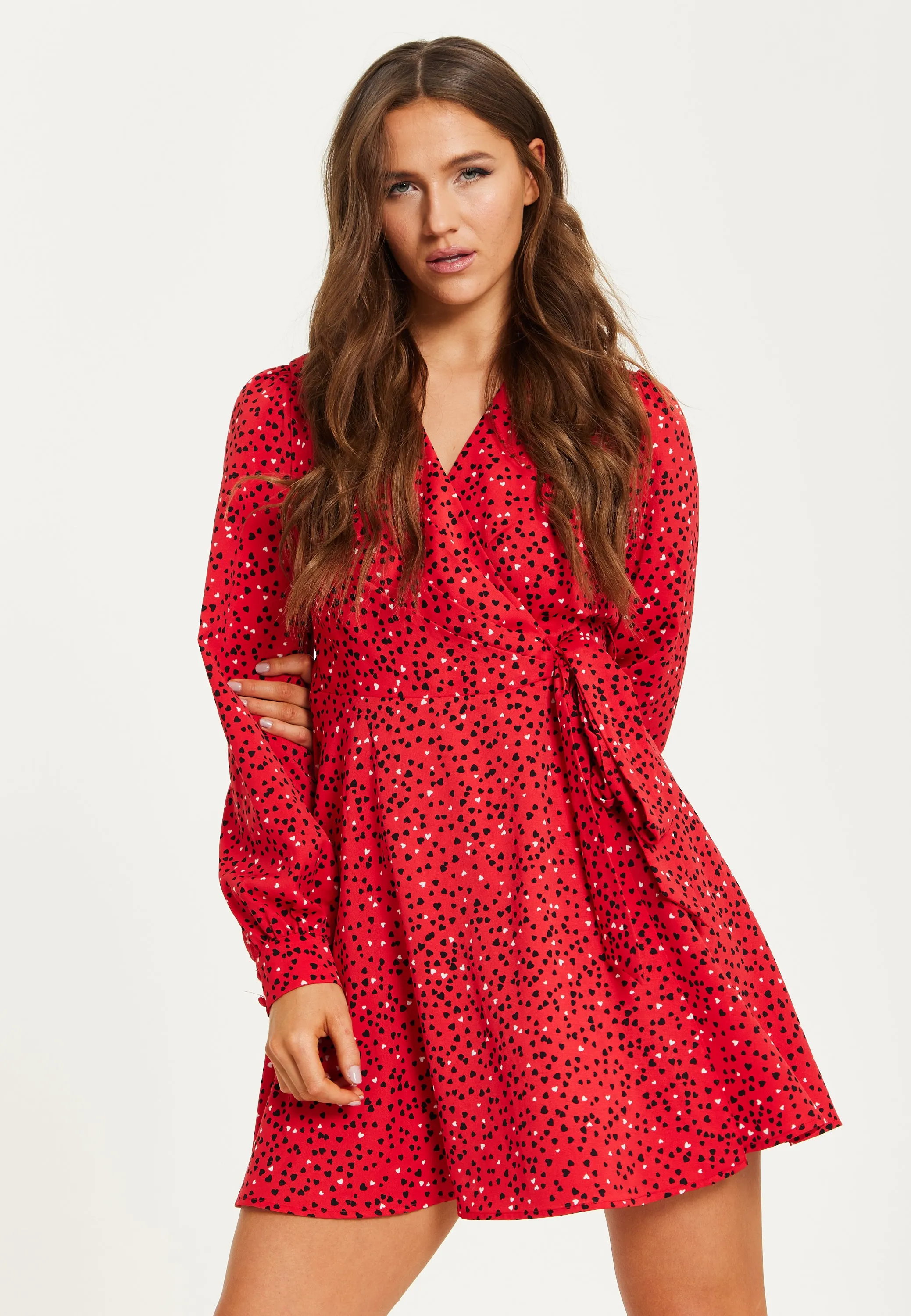 Women's Mini Dress with Long Sleeves in Red - Heart Print Wrap Style, V Neck, Adjustable Tie Waist, by Liquorish